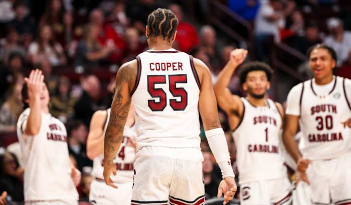 Gamecocks players react after a basket and foul by South Carolina Gamecocks guard Ta'Lon Cooper